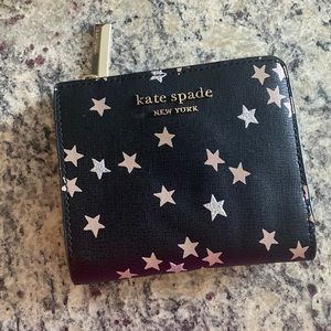 Never used wallet. Fold up with zipper and snap